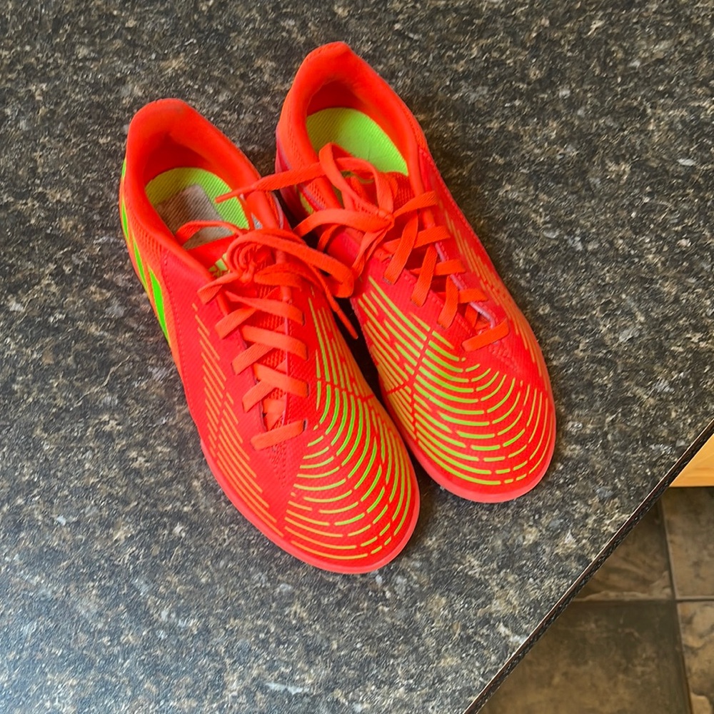 Kids adidas predator soccer shoes.
